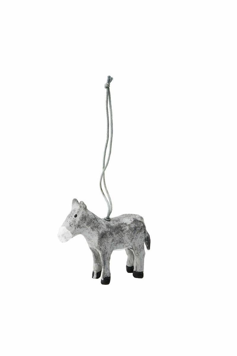 Decorative donkey ornament hanging on a white background