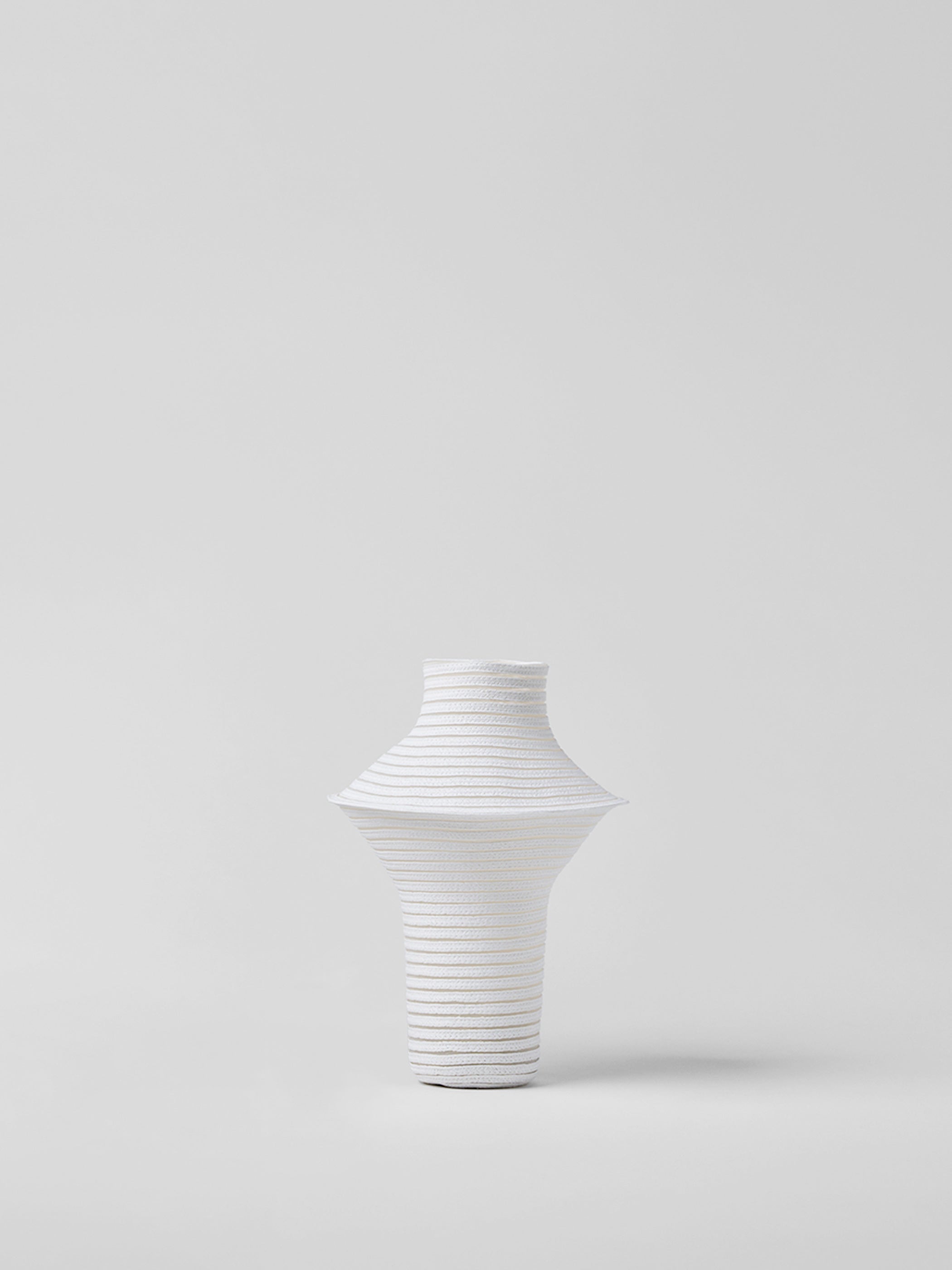 White paper vase on a light gray background