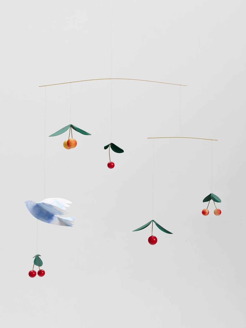 baby mobile with birds and cherries on a white background