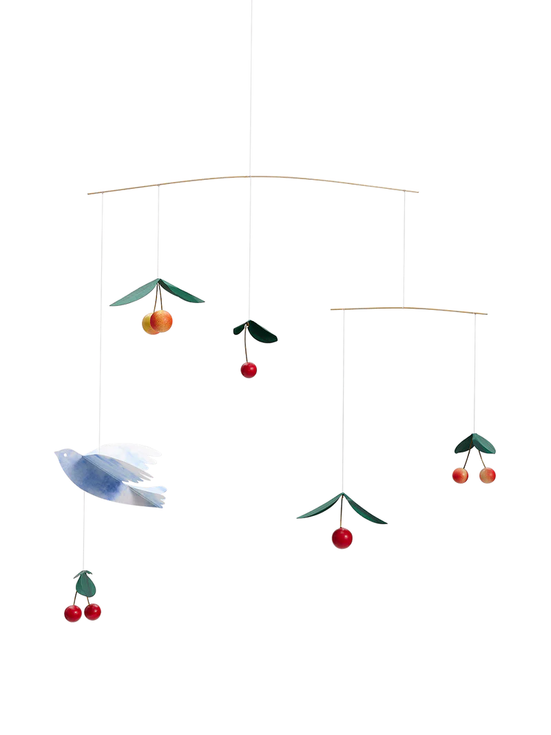 Colorful mobile with birds and cherries on a white background