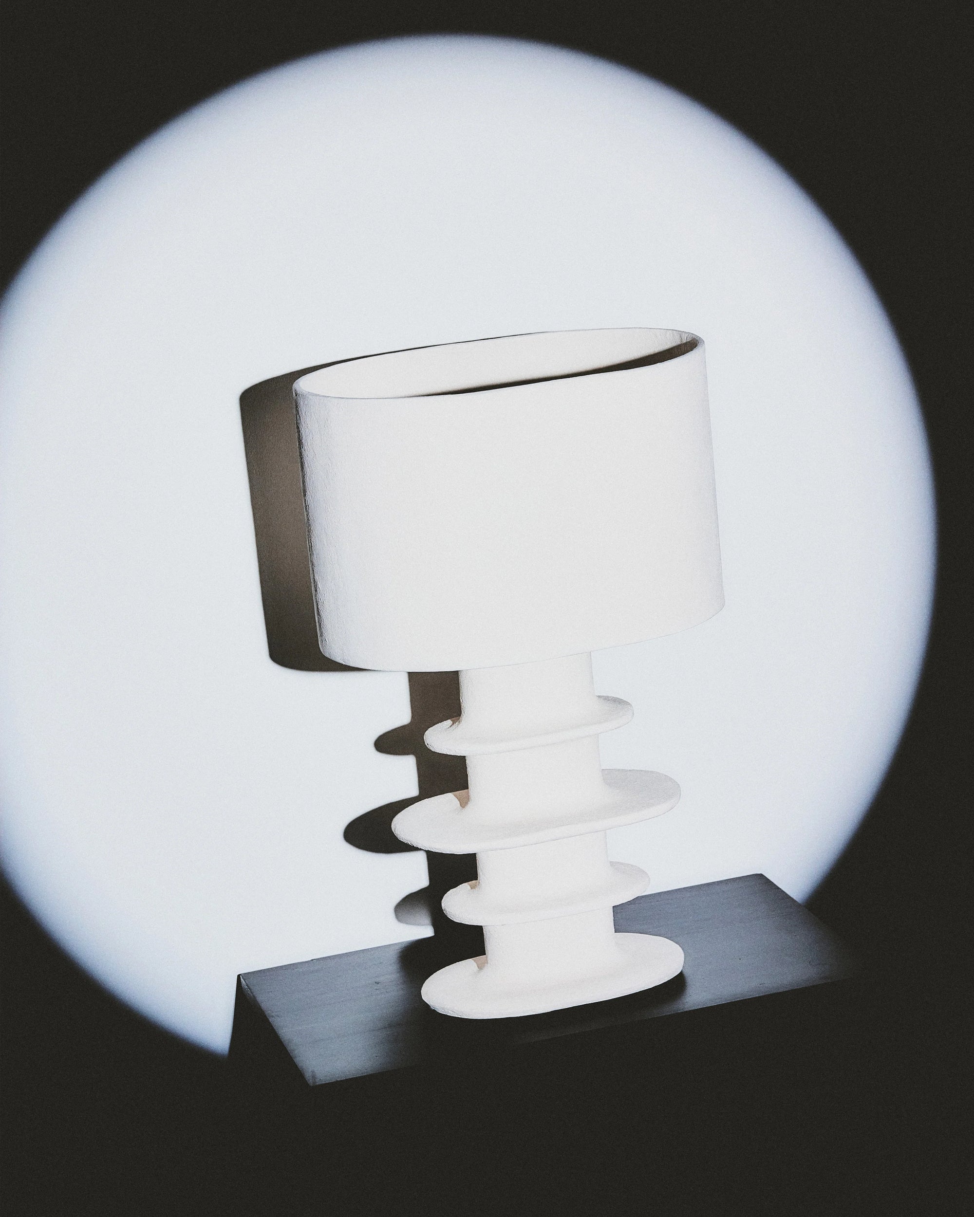 Organic geometrical white paper mache table lamp by Serax, featuring a hand-sculpted base and stunning illumination.