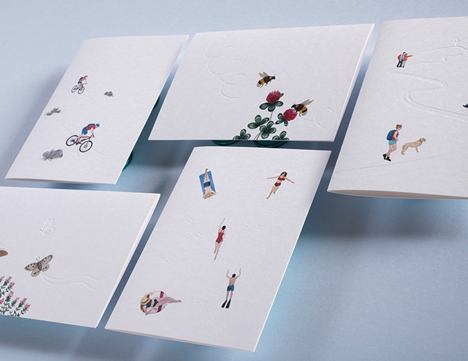 Set of greeting cards with small illustrations on a light blue background