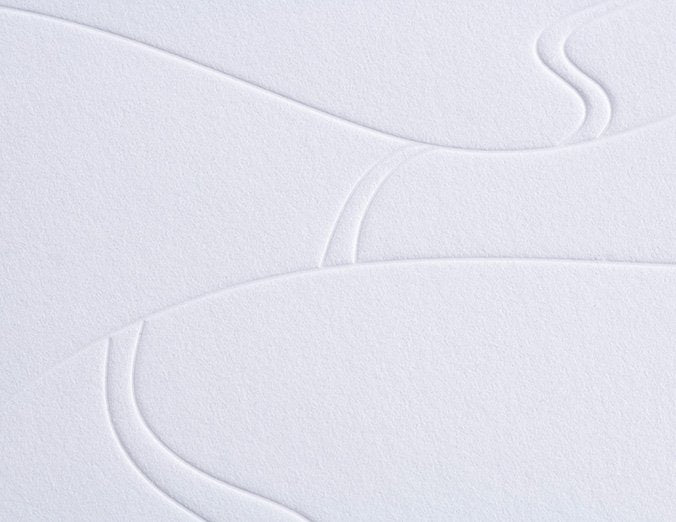 Close-up of textured white paper with wavy lines