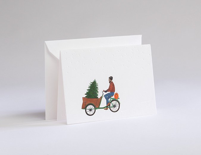 Greeting card with a bicycle and tree design on a white background