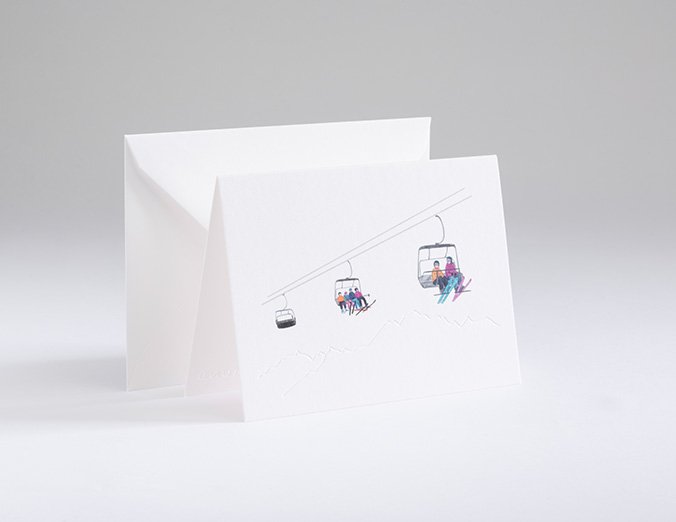 Greeting card with ski lift design on a white background