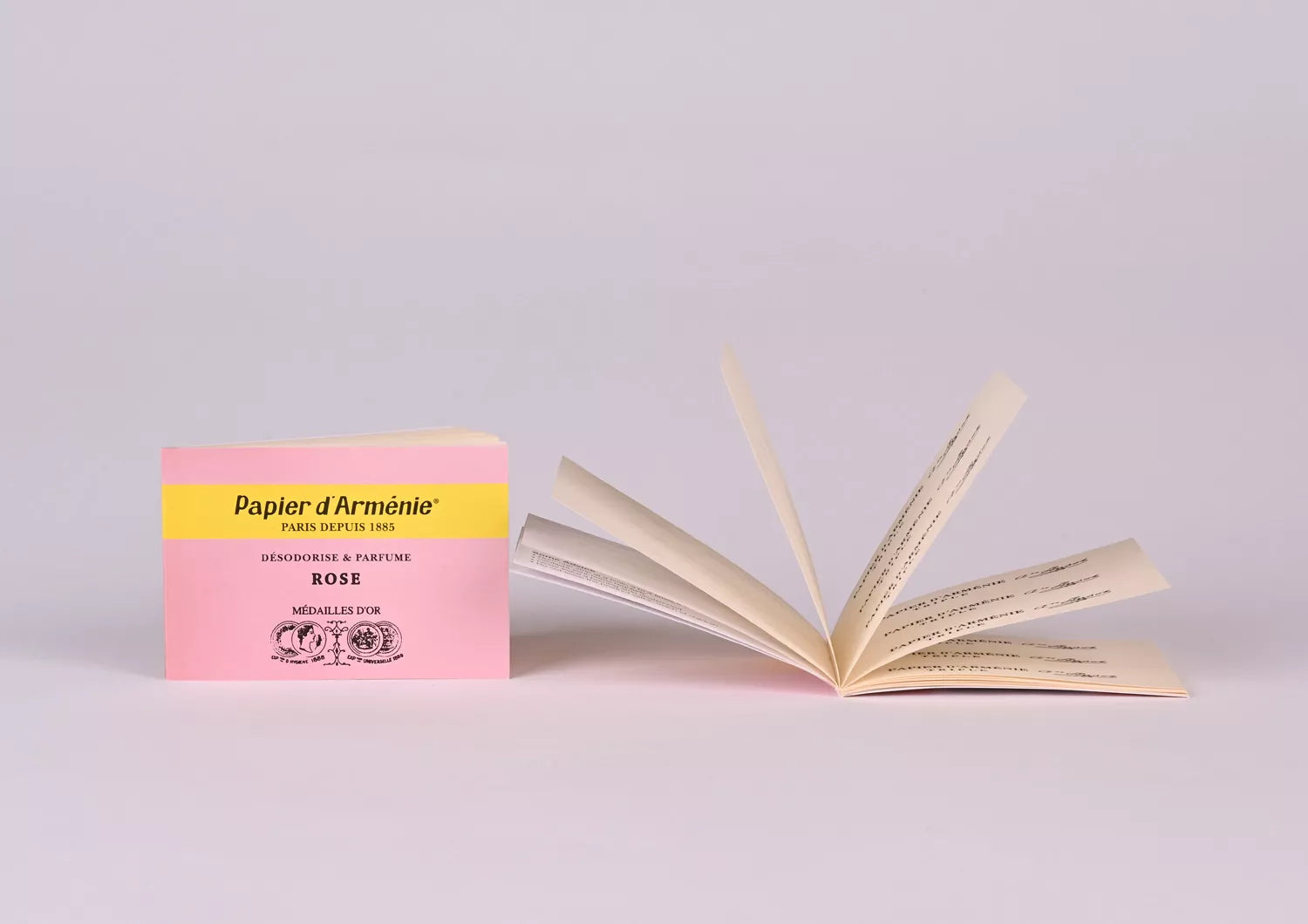 Papier d'Arménie Rose booklet product packaging with an open book on a light gray background