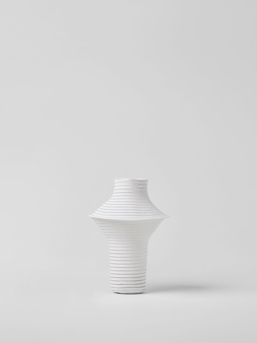White paper vase on a light gray background